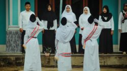 a group of people in white robes